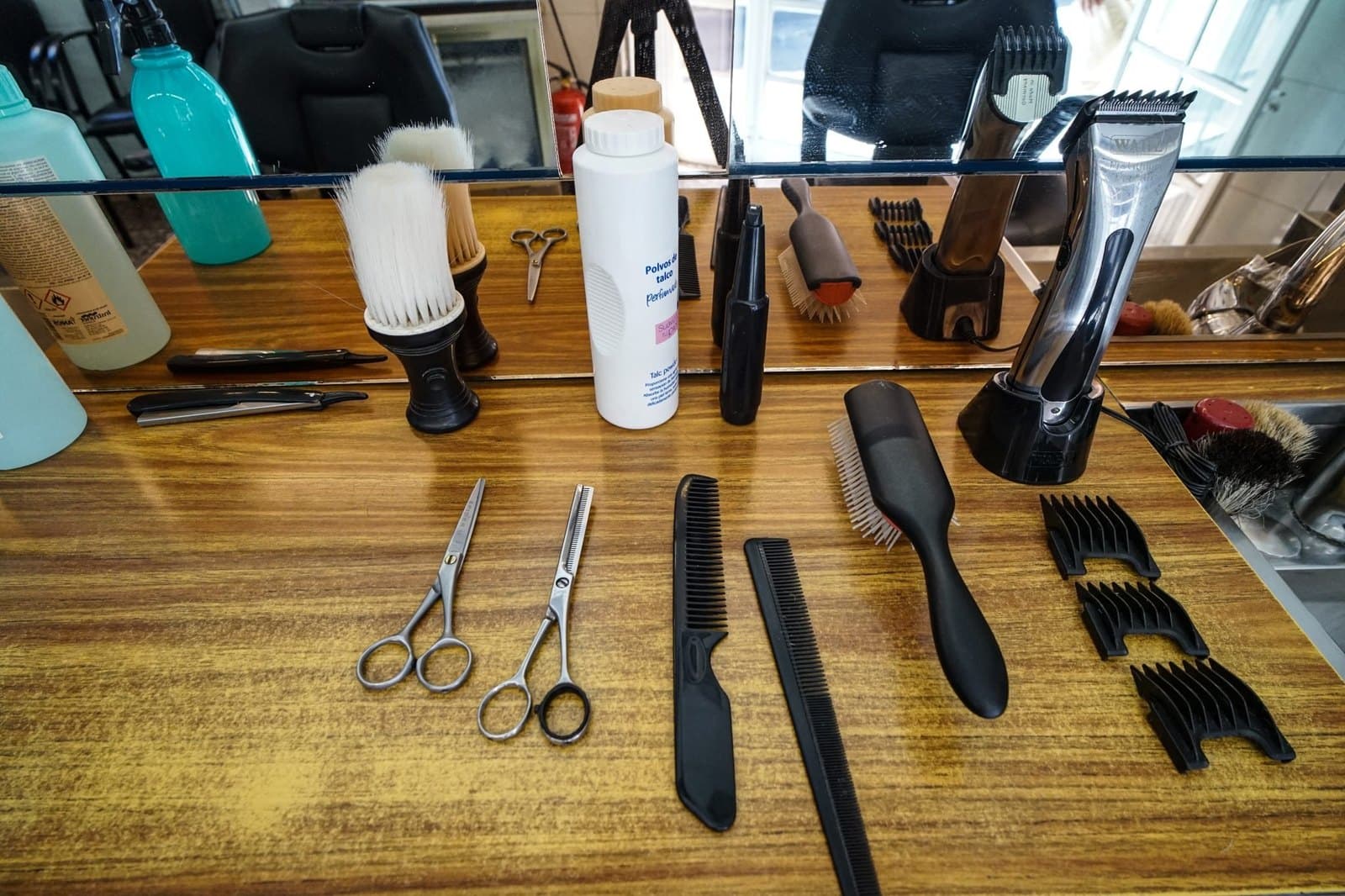 Salon tools laid out on a wooden counter